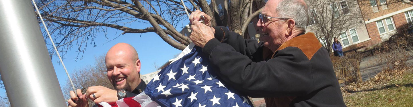 Officer fast hanging american flag