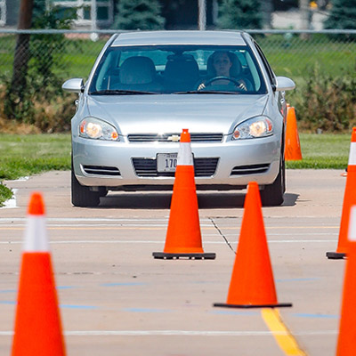 car driving around cones for drivers education