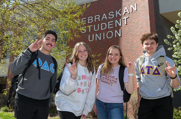 Fraternity and Sorority members posing for a photo