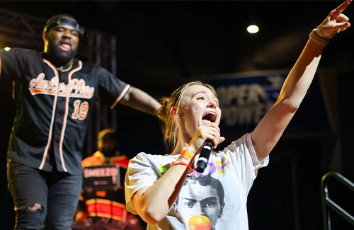 a student and mc sing at aux cord wars event