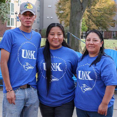The Garcia Santos family pose for a photo outside the student union