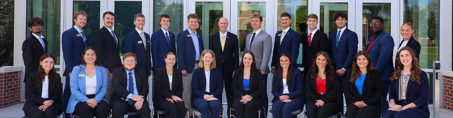 student government members pose for a photo with chancellor