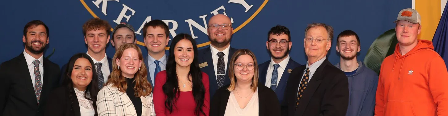 a group of student government members pose for a photo at inauguration  