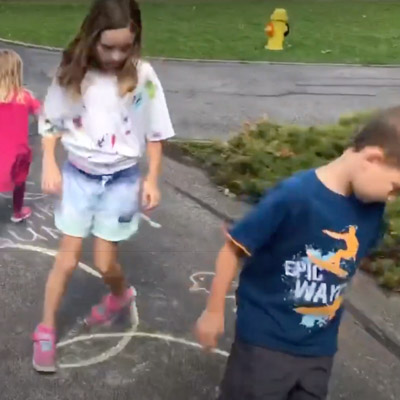 kids playing with chalk obstacle course