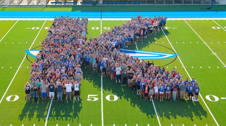 Students forming K on Foster Field