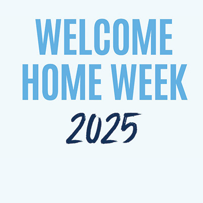 image of students posing together at a welcome home event