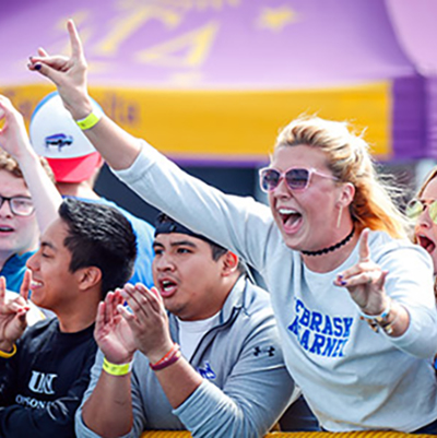 UNK students cheering on the Lopers at a football game