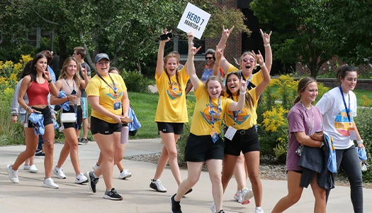 students walk in the parade of lopers
