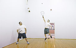 Guys playing racquetball