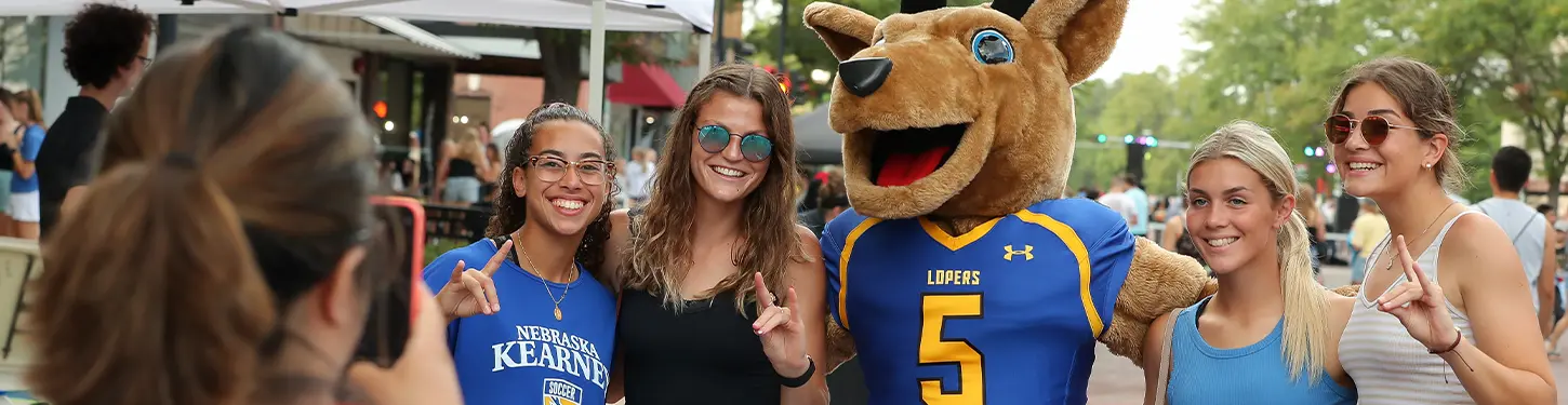 Students pose with Louie the Loper at the Destination Downtown event