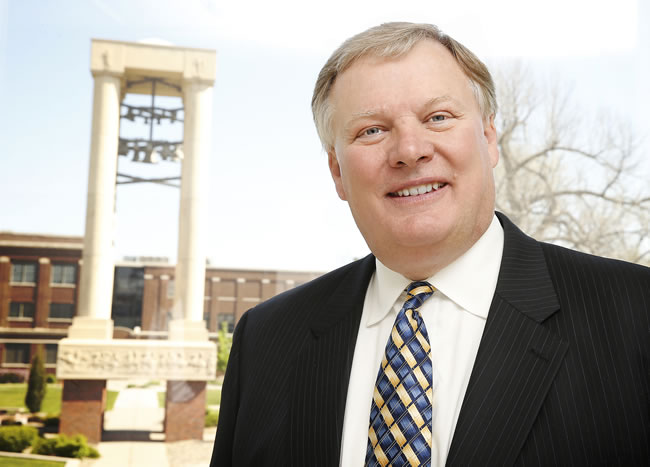 Chancellor Doug Kristensen in Front of the Bell Tower