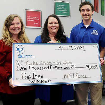 winners at last years big idea event hold up a giant check
