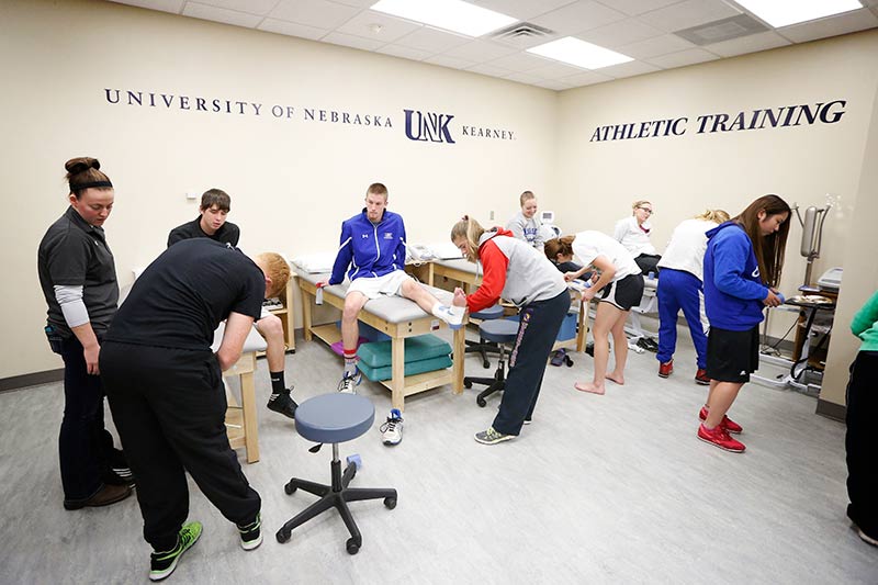 Students in the Athletic Training lab practicing ankle wraps