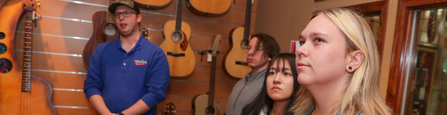 students touring a music store