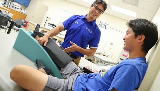 Athletic training graduate student working in a clinic