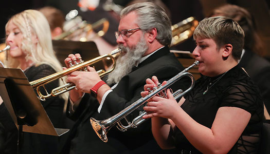 members of KSO play during a performance