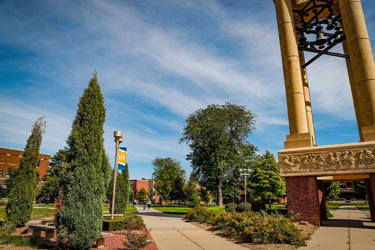 UNK bell tower and campus greens on a sunny day