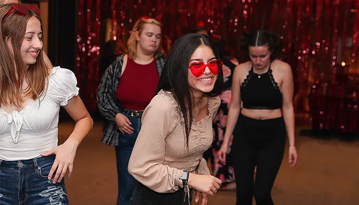 students dance at an event